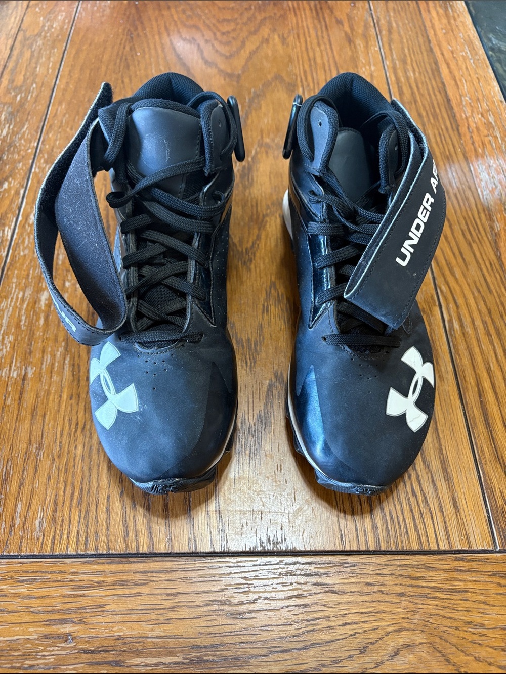 Under Armour Crusher RM Kids Black High-Top Football Cleats with White Logo